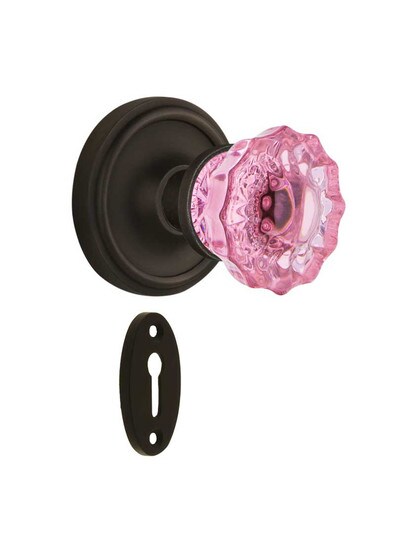 Classic Rosette Mortise Lock Set with Colored Fluted Crystal Glass Knobs Pink in Oil-Rubbed Bronze.
